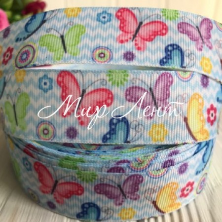 Репс 2,5 см, різнокольорові метелики на блакитному