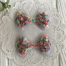 Силіконовий бантик з наповнювачем, 6,3 х3, 6 см, різнокольорові порожні зірки, шт.