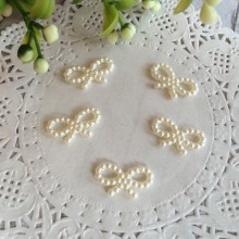 Бантик перламутровий молочний, 1,8 см, ціна за 1 шт.